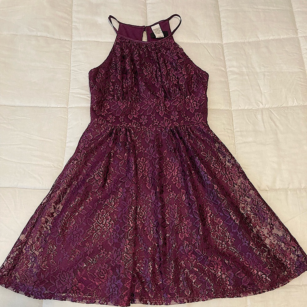 Sleevless women’s purple for and flare dress with subtle floral design